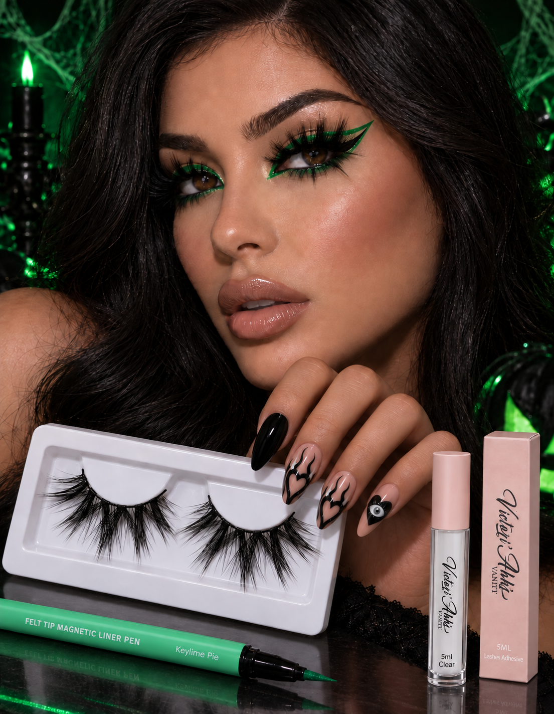 Model wearing SAVAGE lashes, Keylime Pie green eyeliner, and almond-shaped Evil Eye nails with clear lash adhesive